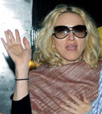 Madonna with her husband coming out of a shop in Mumbai, India